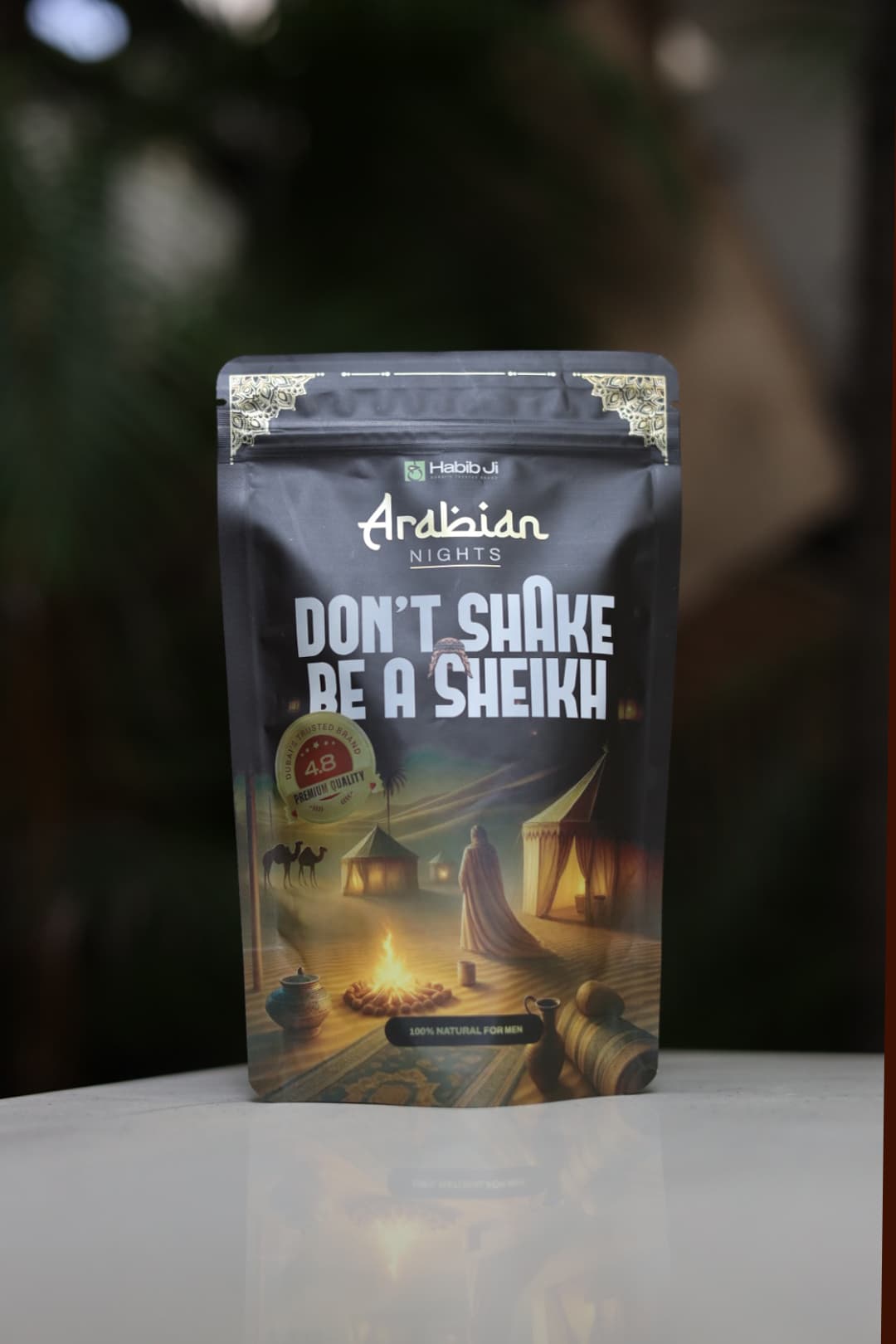Habib Ji Arabian Nights pouch standing on a table with a soft green background